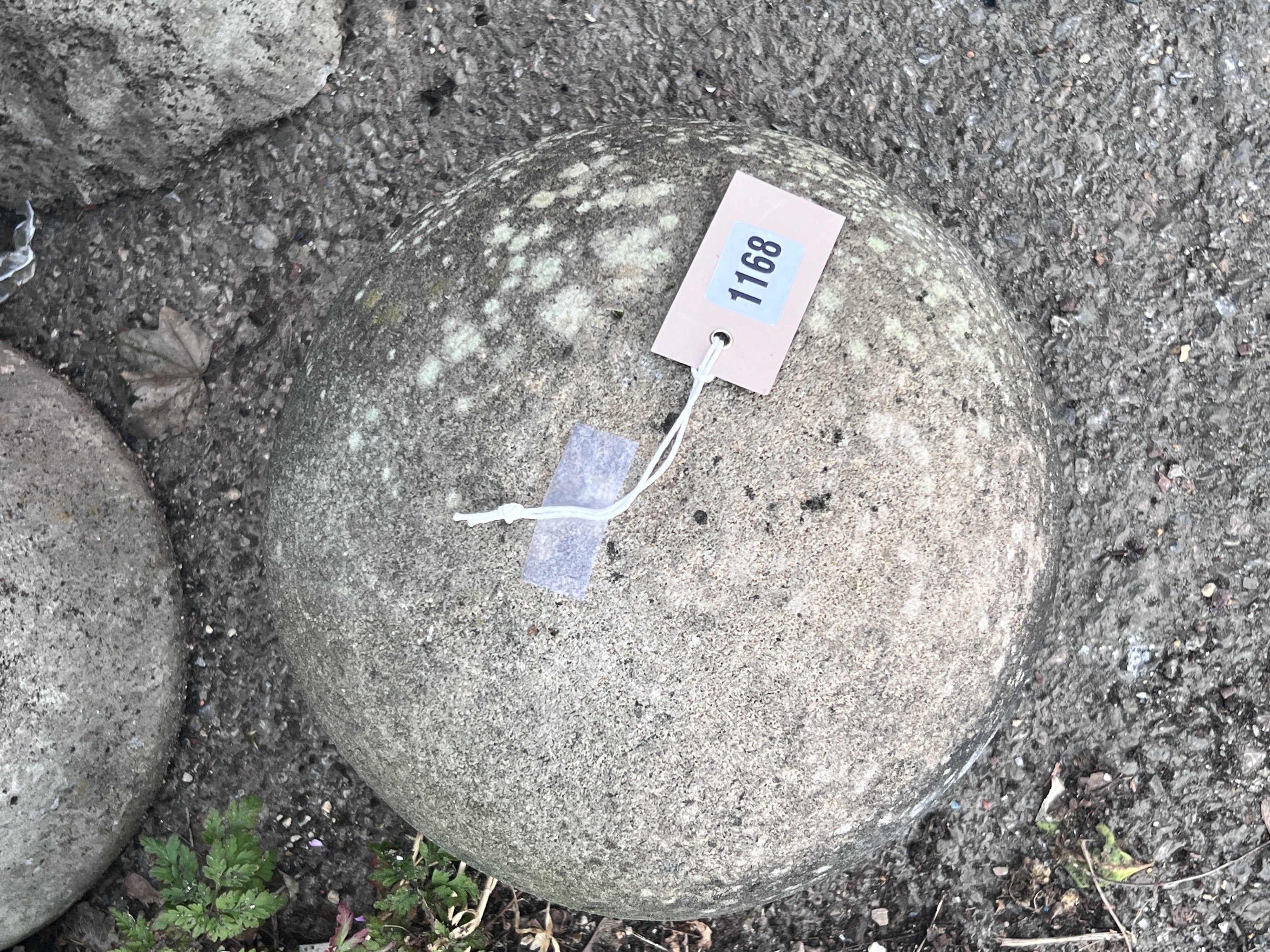 A stone cannon ball garden ornament, height 24cm